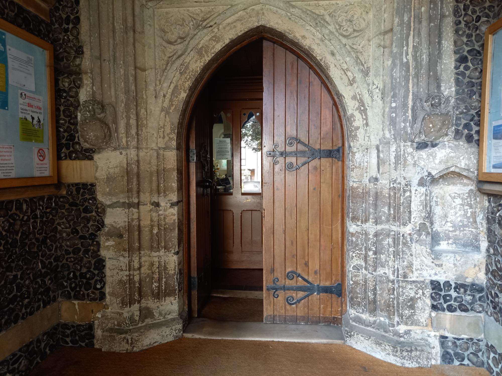 Porch door and niche for holy